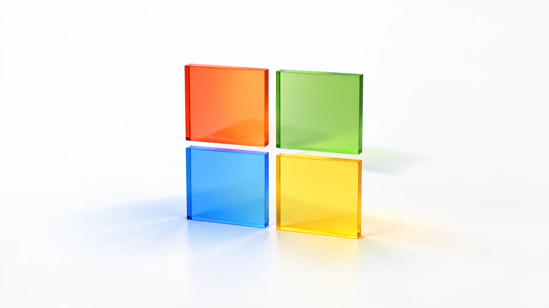 Four translucent glass squares in red, green, blue, and yellow on a white background.